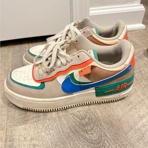 Nike Air Sneakers with Blue and Orange Accents
